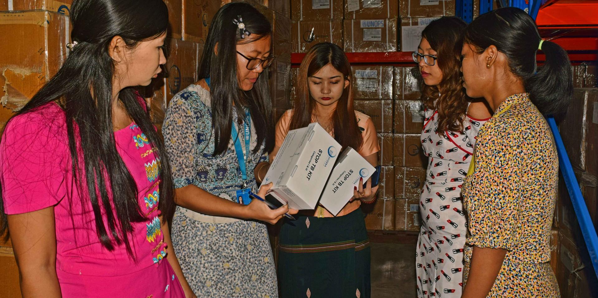 UNOPS-PR Quality Assurance Associate Ei Thu Han taking drug samples together with Yangon FDA team .Photo: UNOPS