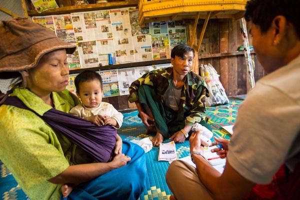 A caregiver from Pyi Gyi Khin conducts home visit to help ensure that those affected by the disease receive the nutritional and psychosocial support they need.  Lwai Hat village, Aung Ban Township, Southern Shan State. Photo: John Rae/The Global Fund
