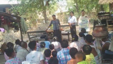 MHAA Myithar Project Community Facilitator U Kyaw Tint gives a TB health education talk to villagers at Thotan village in Myithar Township together with Community TB Volunteer, Daw Myint Myint San. Photo: MHAA